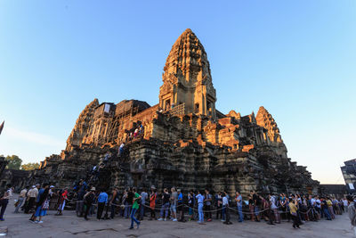 Group of people in front of historical building