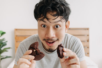 Portrait of man holding ice cream