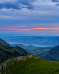 Scenic view of mountains against sky during sunset