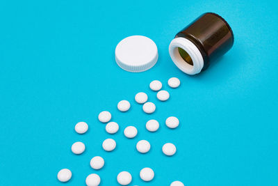 High angle view of blue paint on table