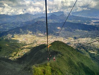 High angle view of overhead cable car against mountains