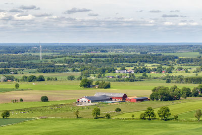 View of a rural landscape with fields and farm