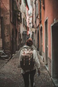 Rear view of man walking on street