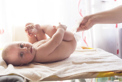 Cute baby lying on bed