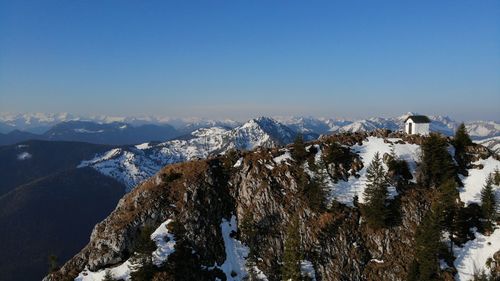 Scenic view of snowcapped mountains against clear sky