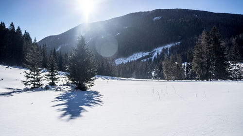 Scenic view of snow covered mountains against sky