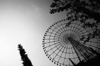 Low angle view of ferris wheel against sky