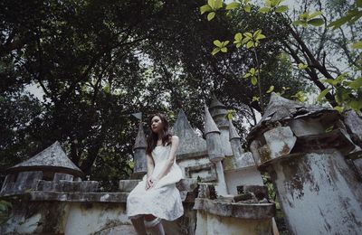 Woman standing by plants