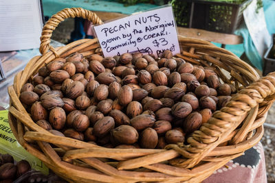 Various fruits in basket for sale at market stall