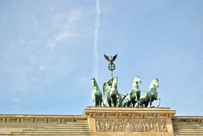 Low angle view of brandenburg gate against blue sky
