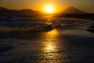 Scenic view of sea against sky during sunset