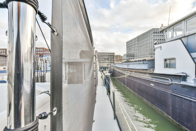 Panoramic view of bridge and buildings against sky