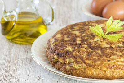 Close-up of spanish omelet served in plate on table