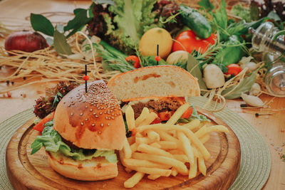 Close-up of burger and vegetables in plate