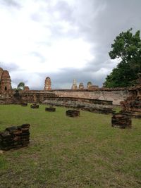 Ruins of temple against cloudy sky