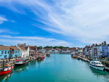 Boats moored at harbor