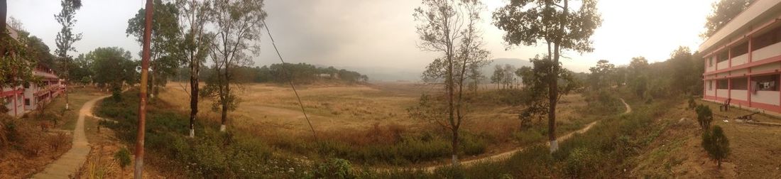Panoramic shot of field against sky