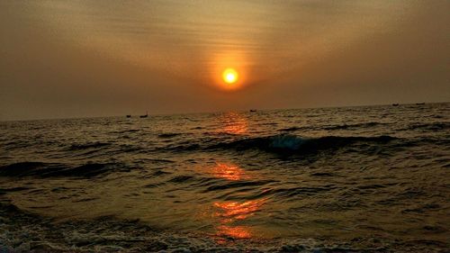 Scenic view of sea at sunset