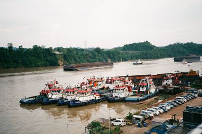 High angle view of boats moored on river against sky