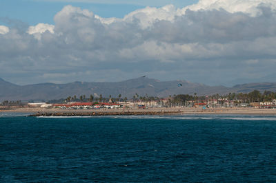 Scenic view of sea against cloudy sky