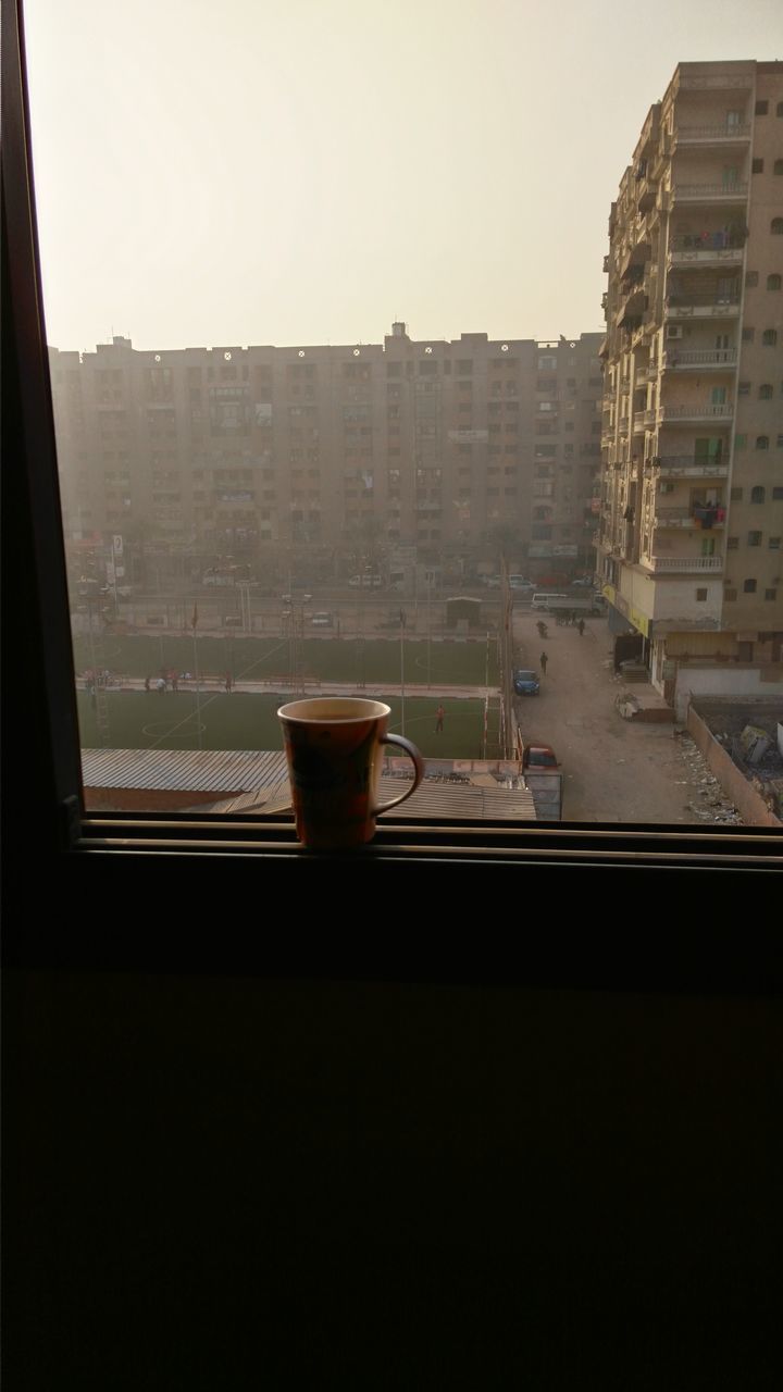 window, architecture, built structure, building exterior, glass - material, indoors, transparent, city, clear sky, building, glass, copy space, looking through window, day, residential building, residential structure, no people, modern, sky, reflection