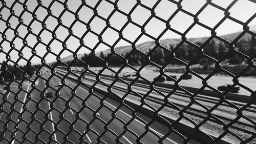 Full frame shot of chainlink fence against sky