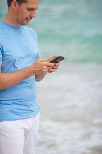 Young man using mobile phone