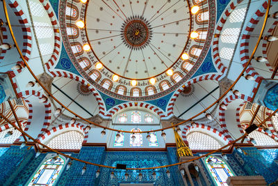 Low angle view of illuminated ceiling of building