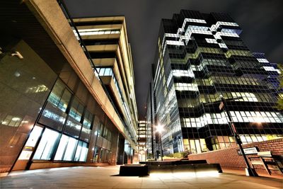 Low angle view of illuminated buildings at night