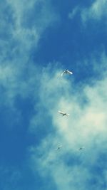 Low angle view of airplane flying in sky