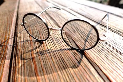 High angle view of eyeglasses on wood