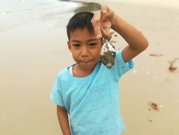 Portrait of cute boy on beach