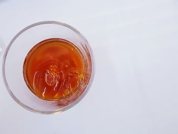 Close-up of drink over white background