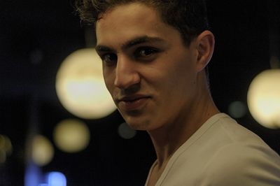 Close-up portrait of young man looking away