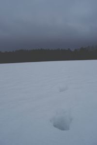 Scenic view of landscape against sky during winter