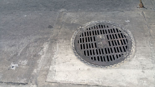 High angle view of manhole on street