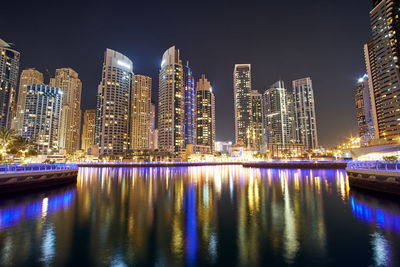 Illuminated buildings in city at night