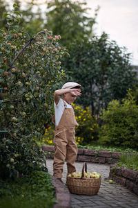 Man standing in basket of tree