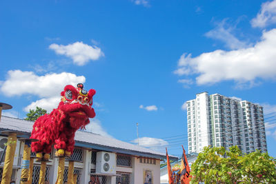 Low angle view of buildings against blue sky