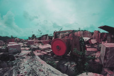 Abandoned car against sky