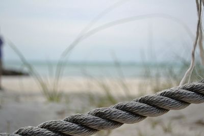 Close-up of rope against sea