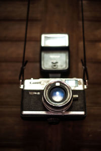 Close-up of camera on table