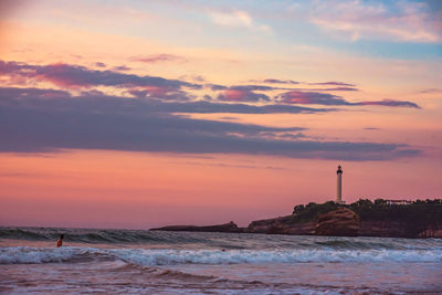 Scenic view of sea against orange sky