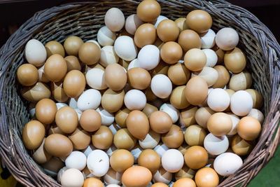 High angle view of eggs in basket on table