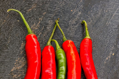 Close-up of red chili peppers on table