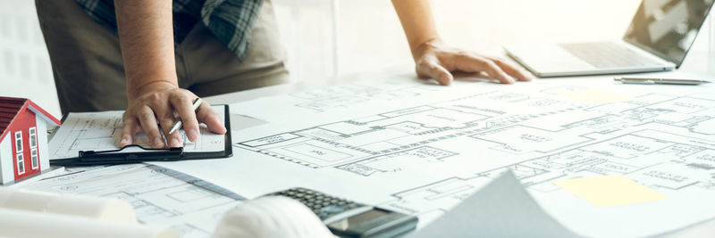 Low section of people working on table