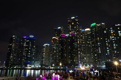 Illuminated buildings in city at night