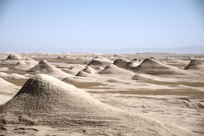 Scenic view of desert against clear sky