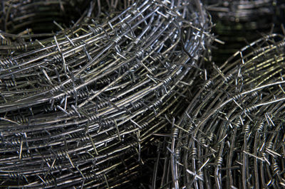 Close-up of coiled barbed wire in factory