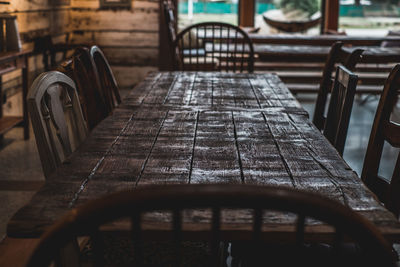 Empty table and chairs at restaurant